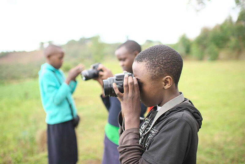  2019 Project participants using their cameras 