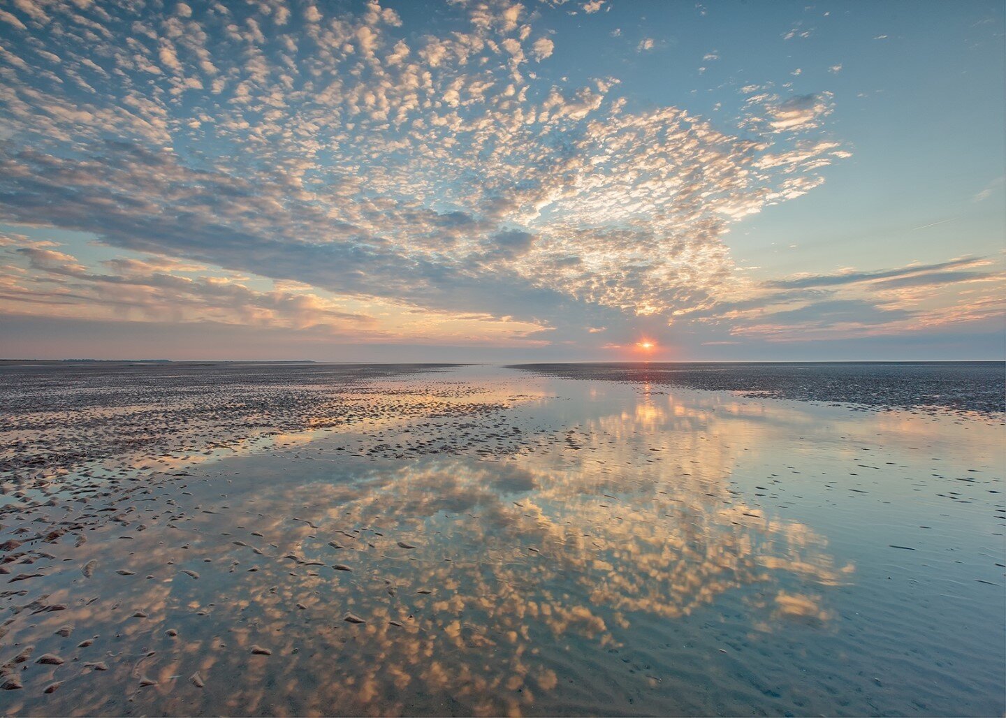 Brancaster Sunset by Maurice Young which was commended by Graeme Taplin when he judged June's Monthly Image Competition - a lovely image that could stand out as simply a classic landscape. However, the longer you look at it, the lines of the horizon,