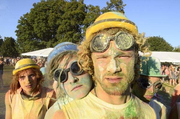  close up of people looking to camera covered in paint powder  