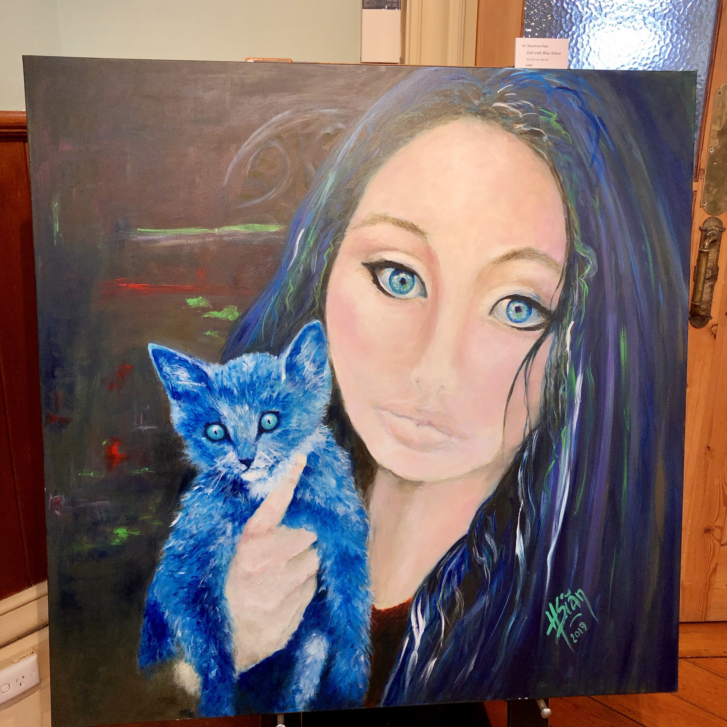 "Girl with blue kitten"