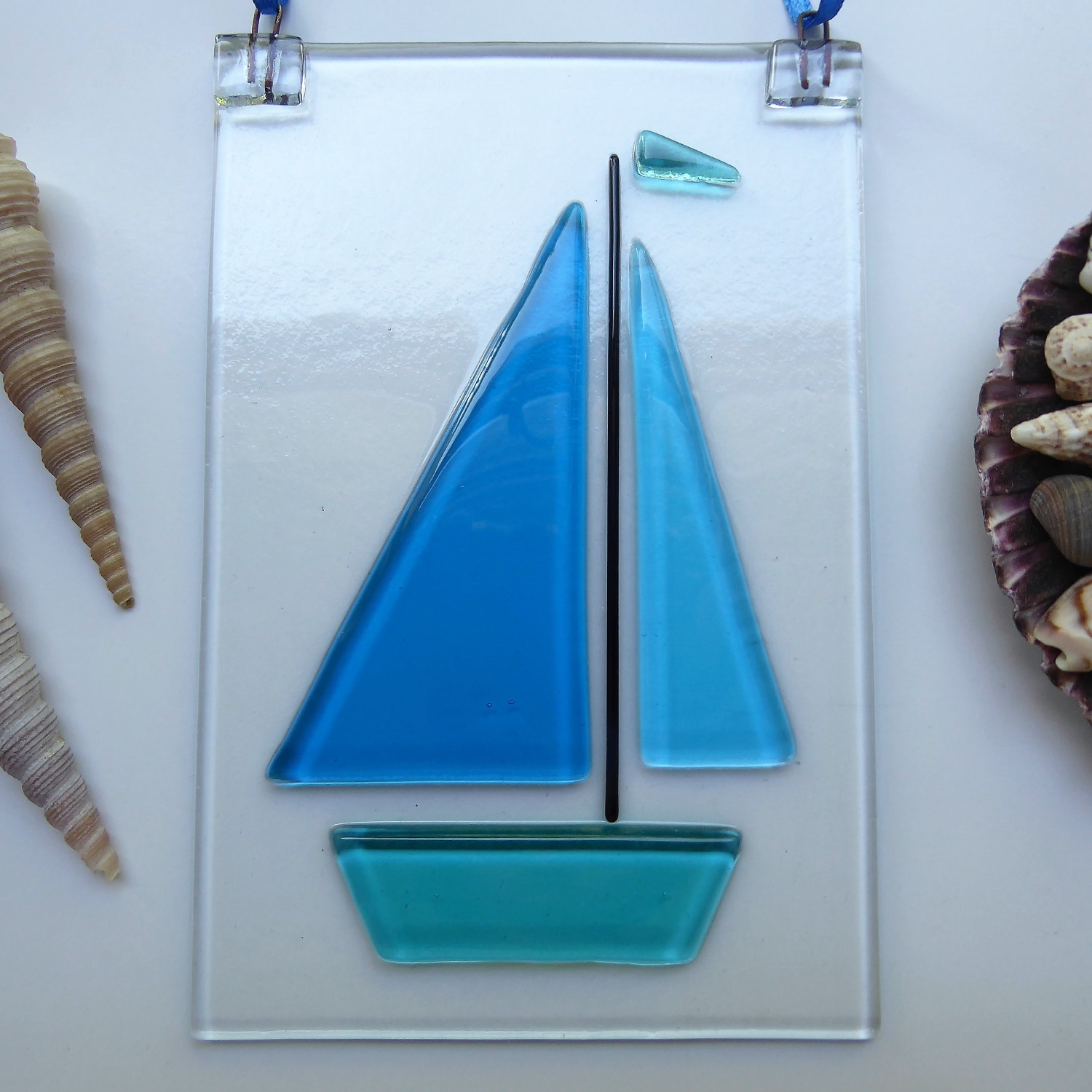 Bright blue sailboat suncatcher