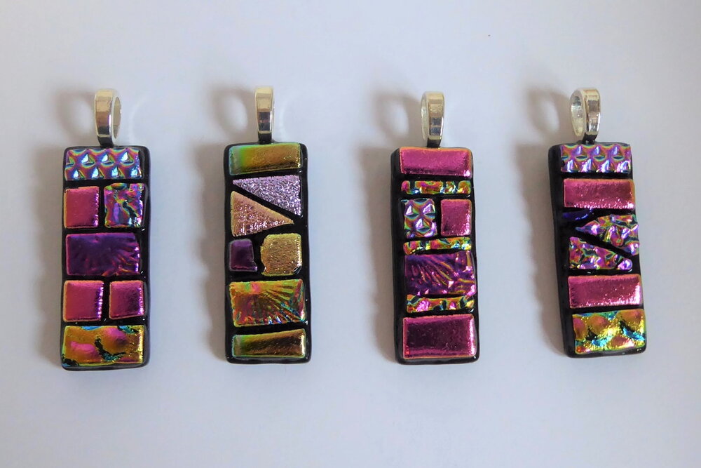 Pink pendants pre- and post-firing. You can see how different some of the colours after they have been fired.