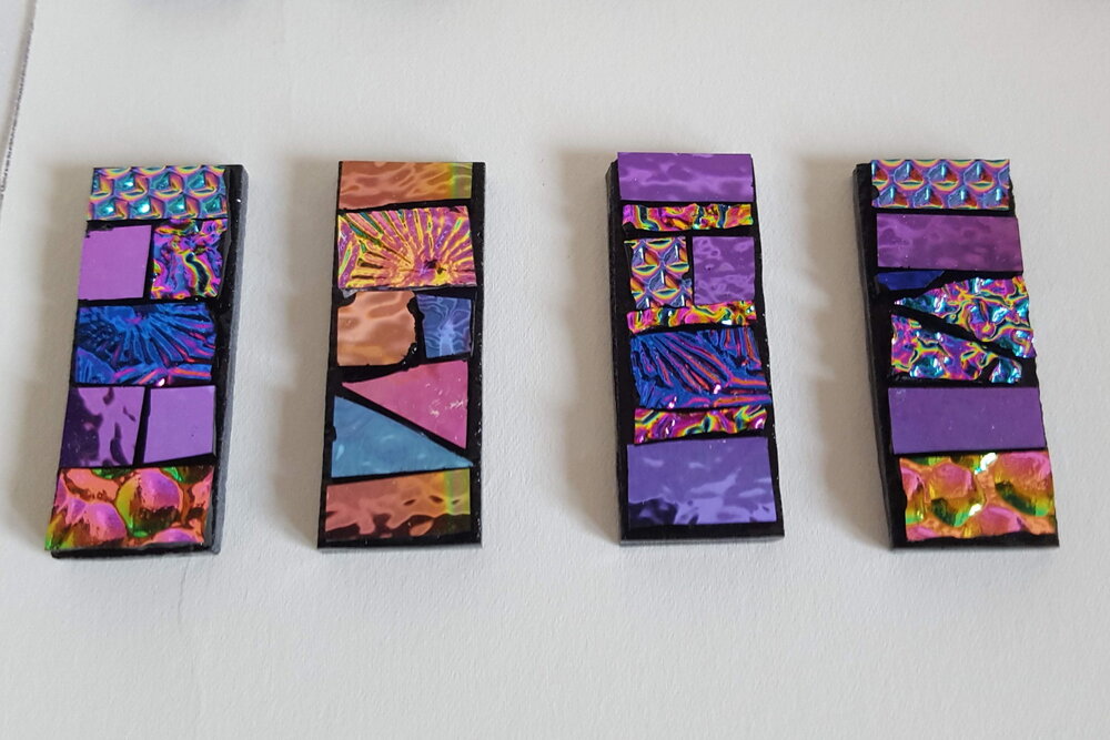 Eva Glass Design pink fused glass mosaic pendants before they have been fired. 