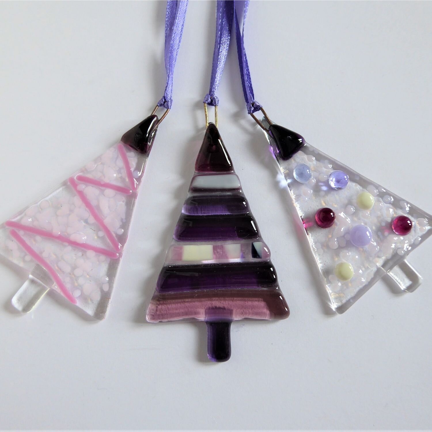  A set of three pink fused glass tree-shaped Christmas decorations by Eva Glass Design 