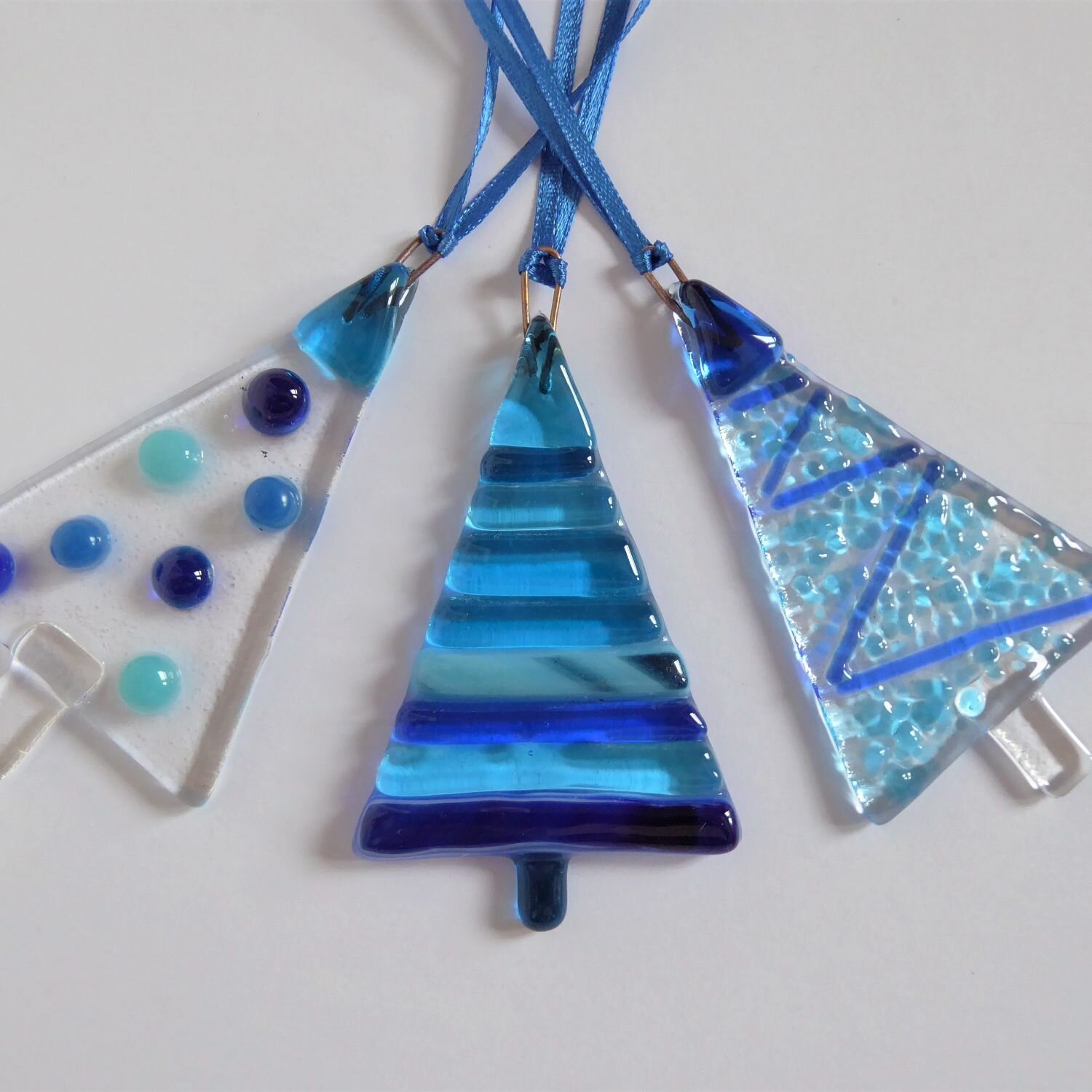  A set of three blue fused glass tree-shaped Christmas decorations by Eva Glass Design 