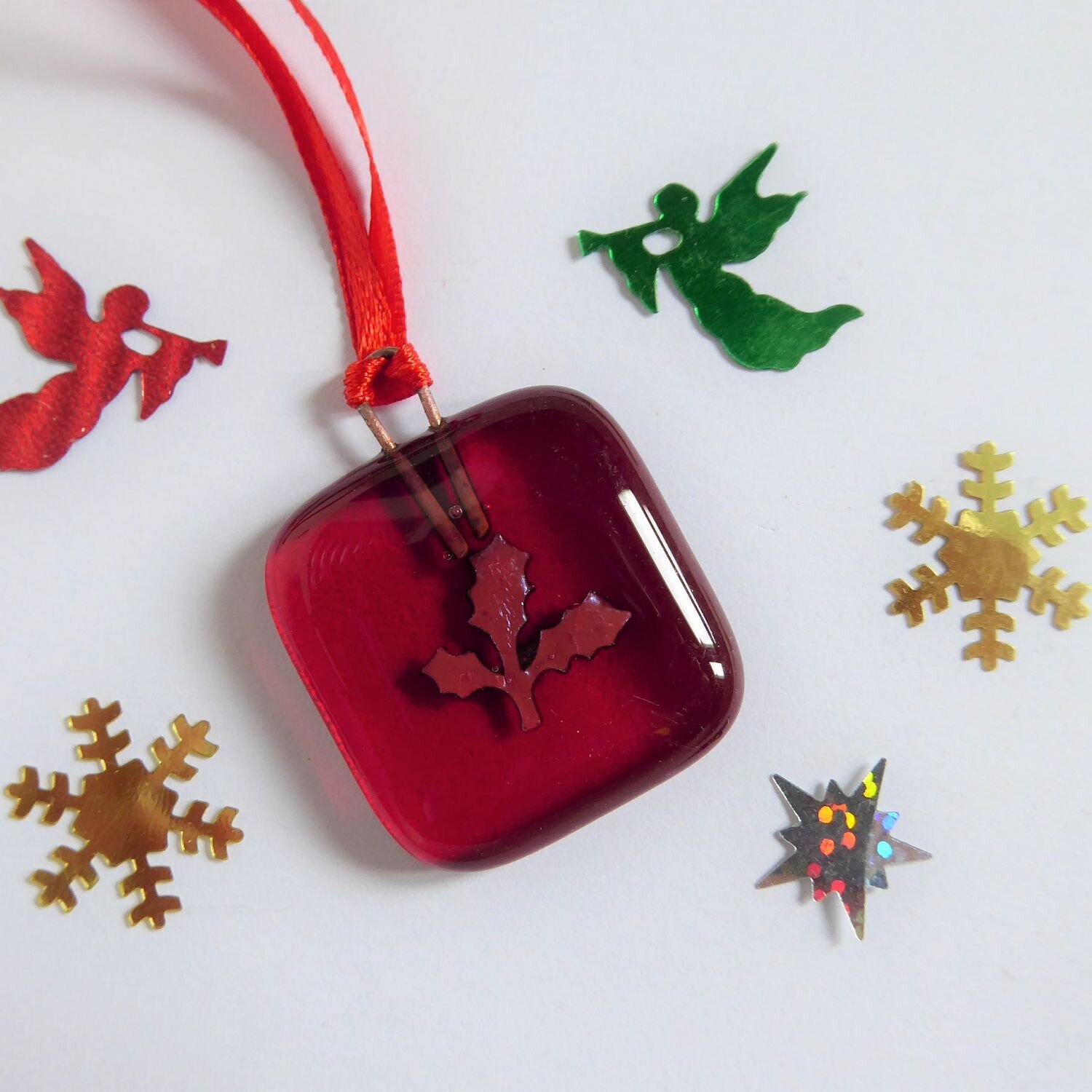  Small square Christmas tree decoration by Eva Glass Design with a copper holly motif on a red background. 