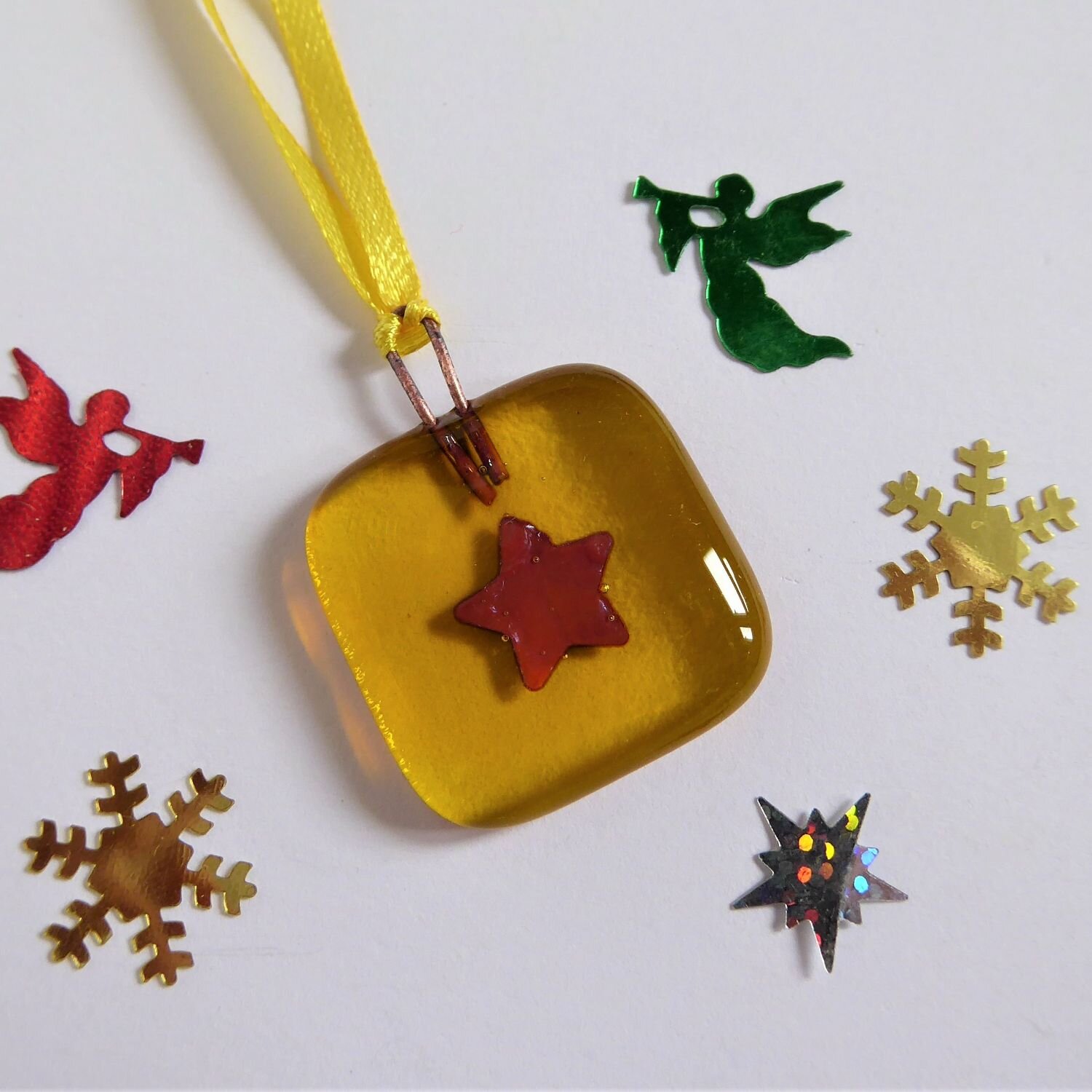  Small square Christmas tree decoration by Eva Glass Design with a copper star motif on a yellow background. 
