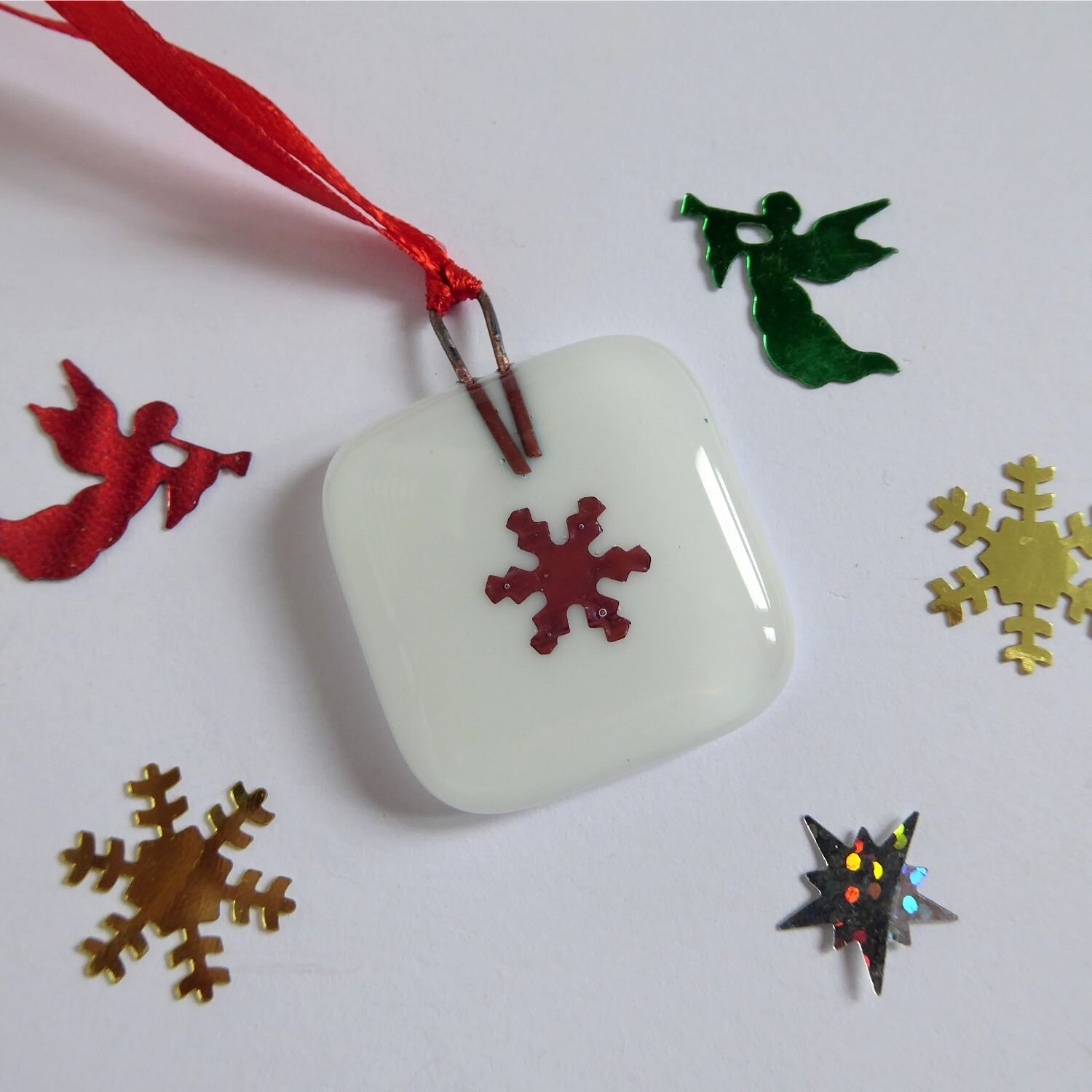  Small square Christmas tree decoration by Eva Glass Design with a copper snowflake motif on a white background. 