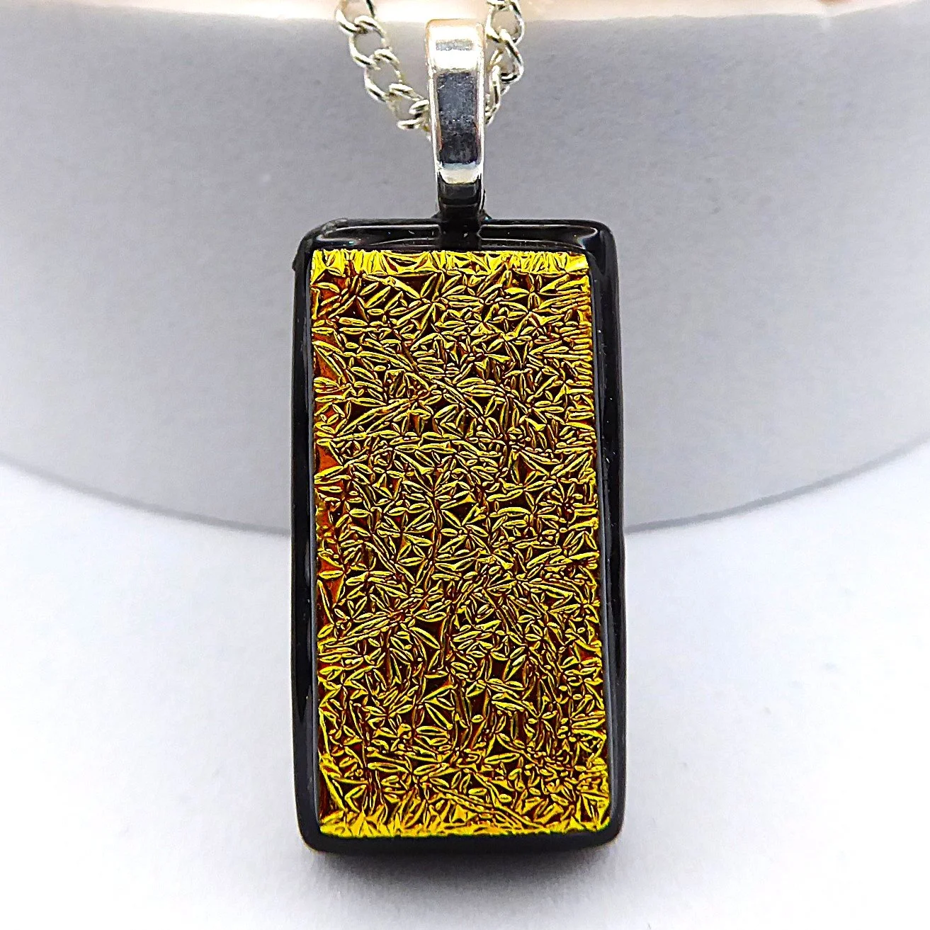  Fused glass necklace with gold dichroic glass fused onto black glass 