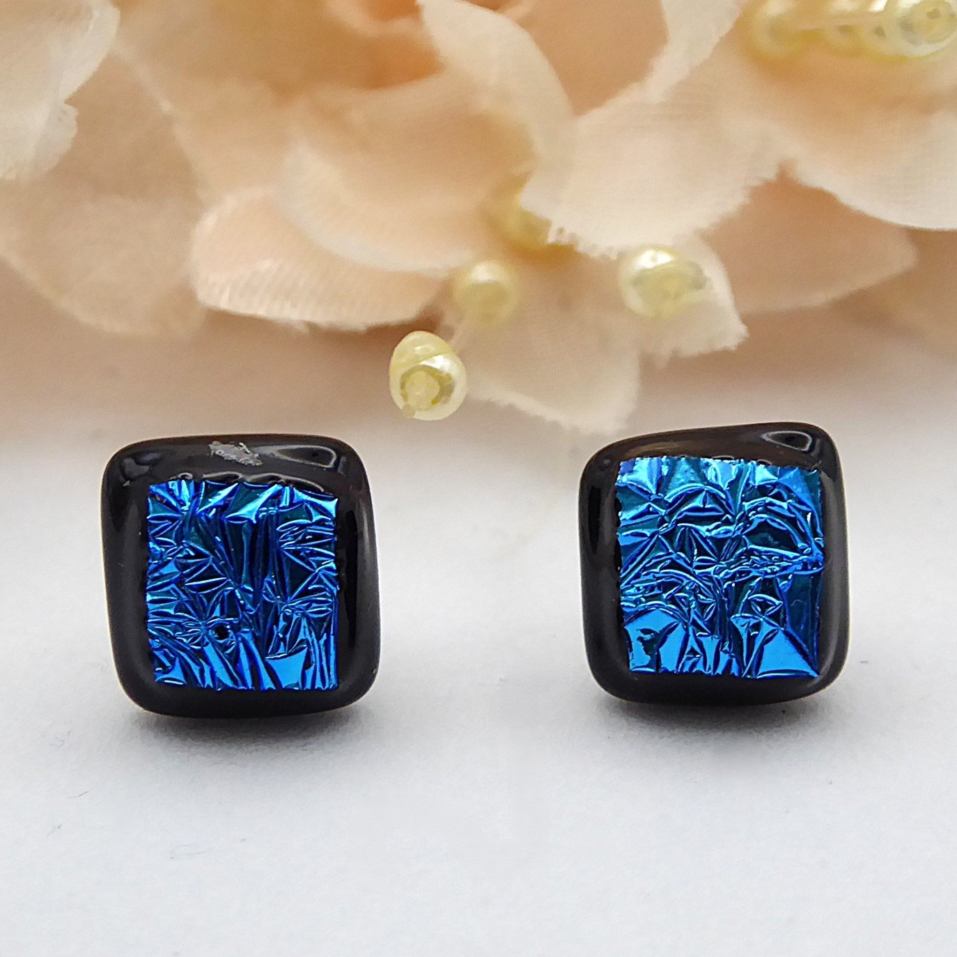  Blue and black dichroic glass earrings in a square style with a textured finish 