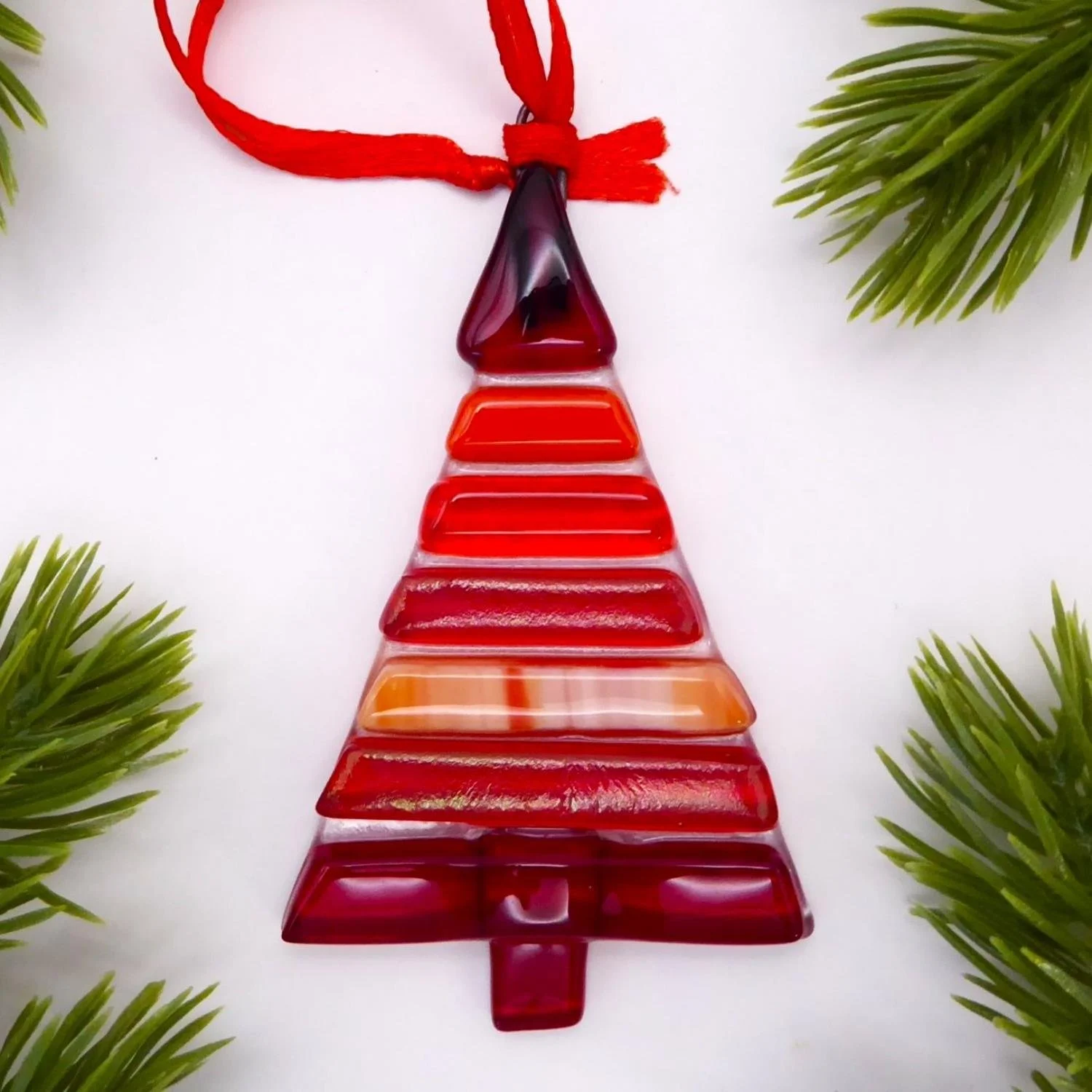  Fused glass Christmas ornament in the shape of a tree with red stripes 