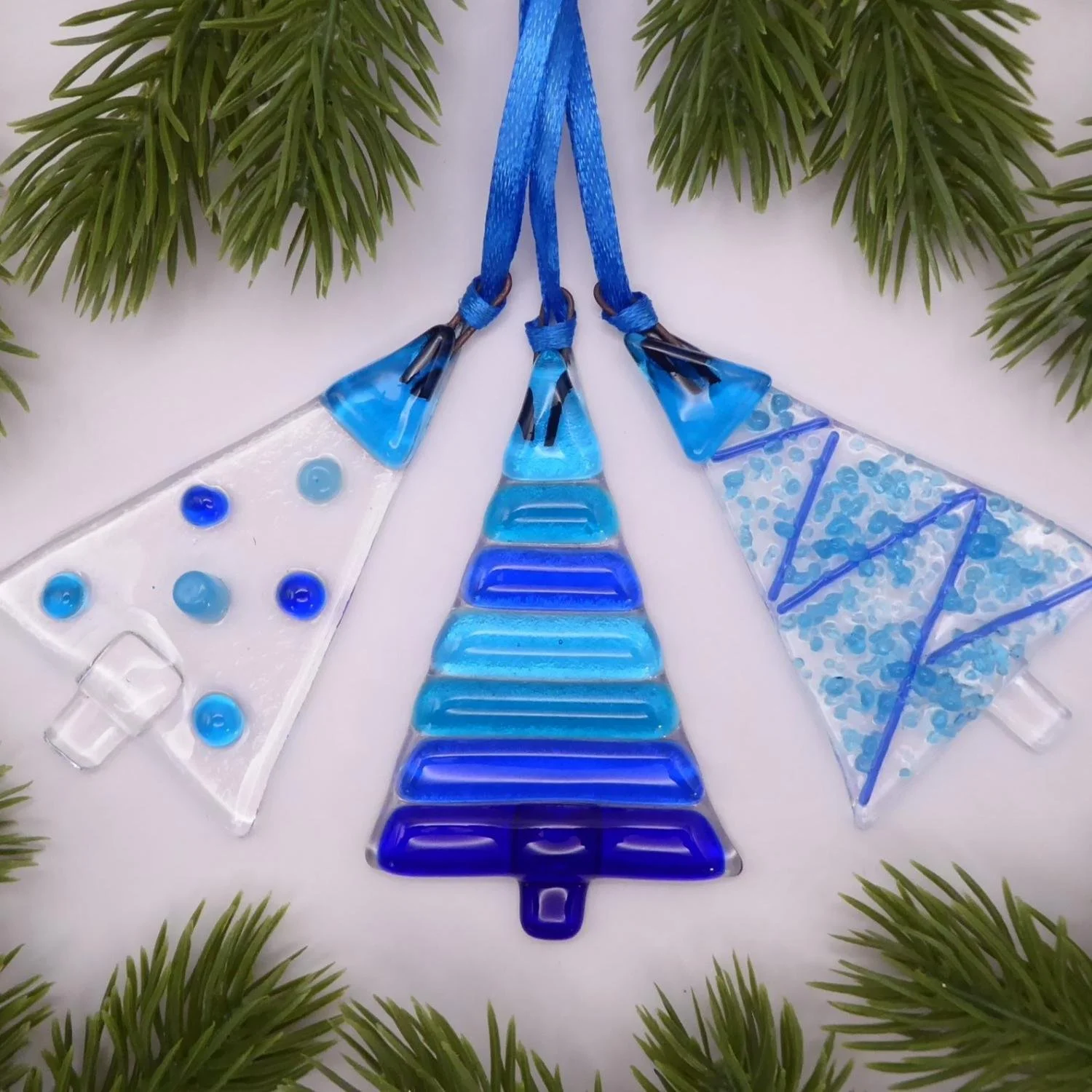  Set of three blue glass handmade Christmas tree-shaped ornaments 