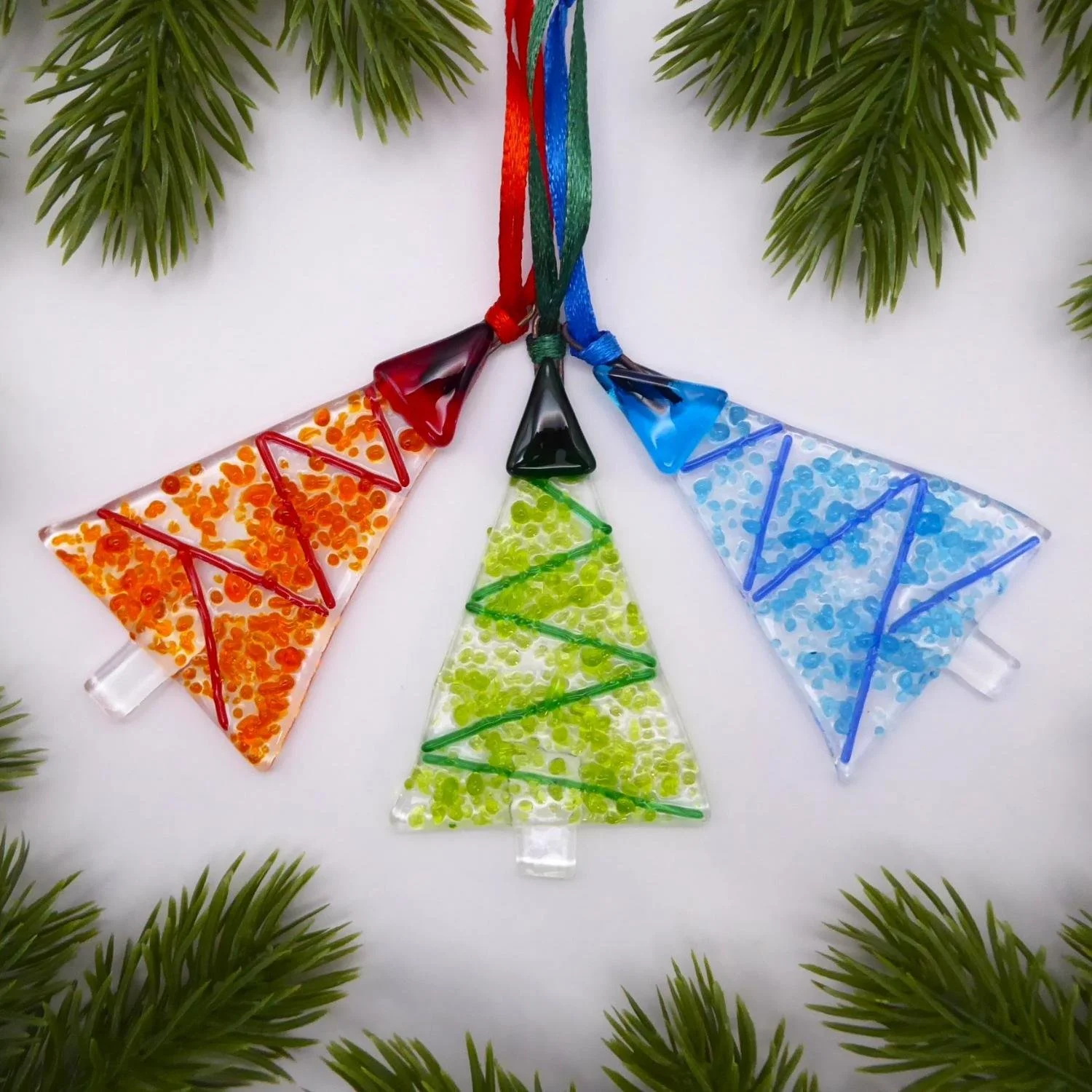  Set of three stylised fused glass Christmas trees with a tinsel design 