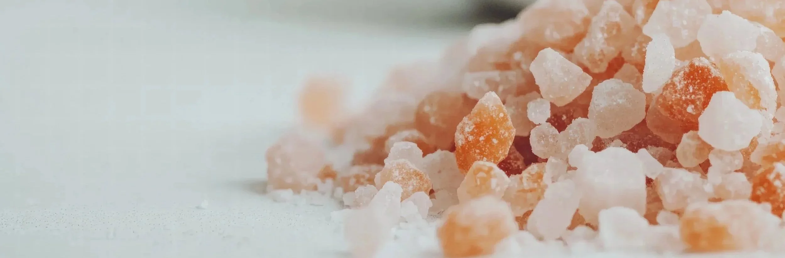 vecteezy_pink-himalayan-salt-crystals-scattered-on-surface-with-bowl_59955429.jpg