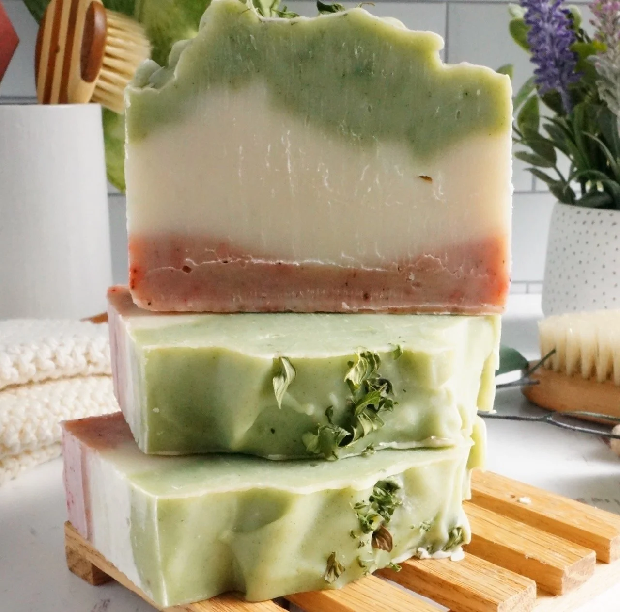 stack artisan soap bars on wood table