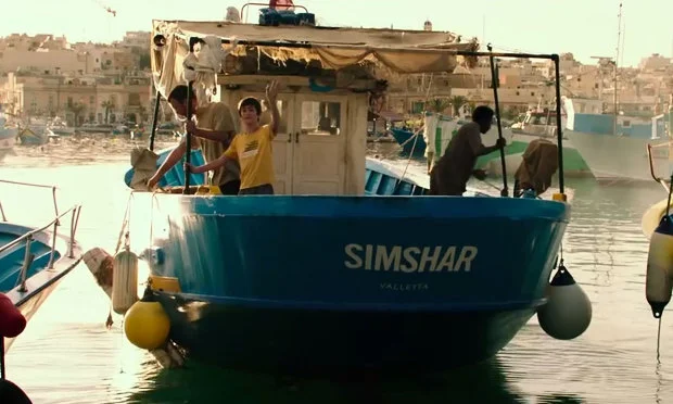 Simshar - Rebecca Cremona, work presented by Henri Guette Young Theo is sent on his first trip with his Maltese sea faring family, but things go terribly wrong when the 'Simshar' sinks, leaving the crew stranded in the Mediterranean... Simultaneously, Alex - a medic reluctantly dispatched onto a Turkish Merchant vessel which has rescued a group of stranded African boat people between Malta and Italy - gets stuck on the boat as the countries wage a bureaucratic war over who should take in the migrants... The stories unravel in parallel and culminate tragically when the fishermen are traced down, but by that time there's only one survivor.