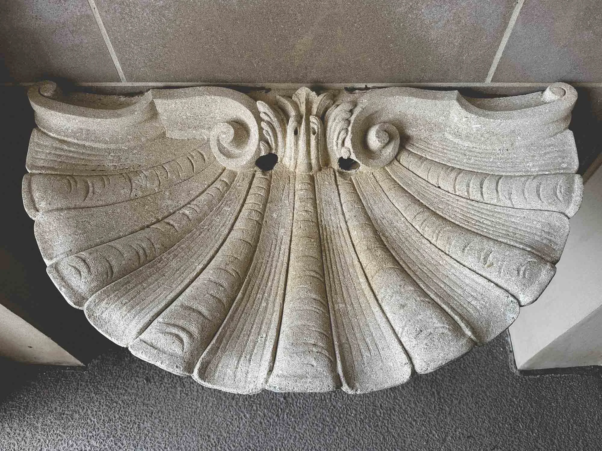 stone fountain basin carved into the shape of a Baroque scallop shell