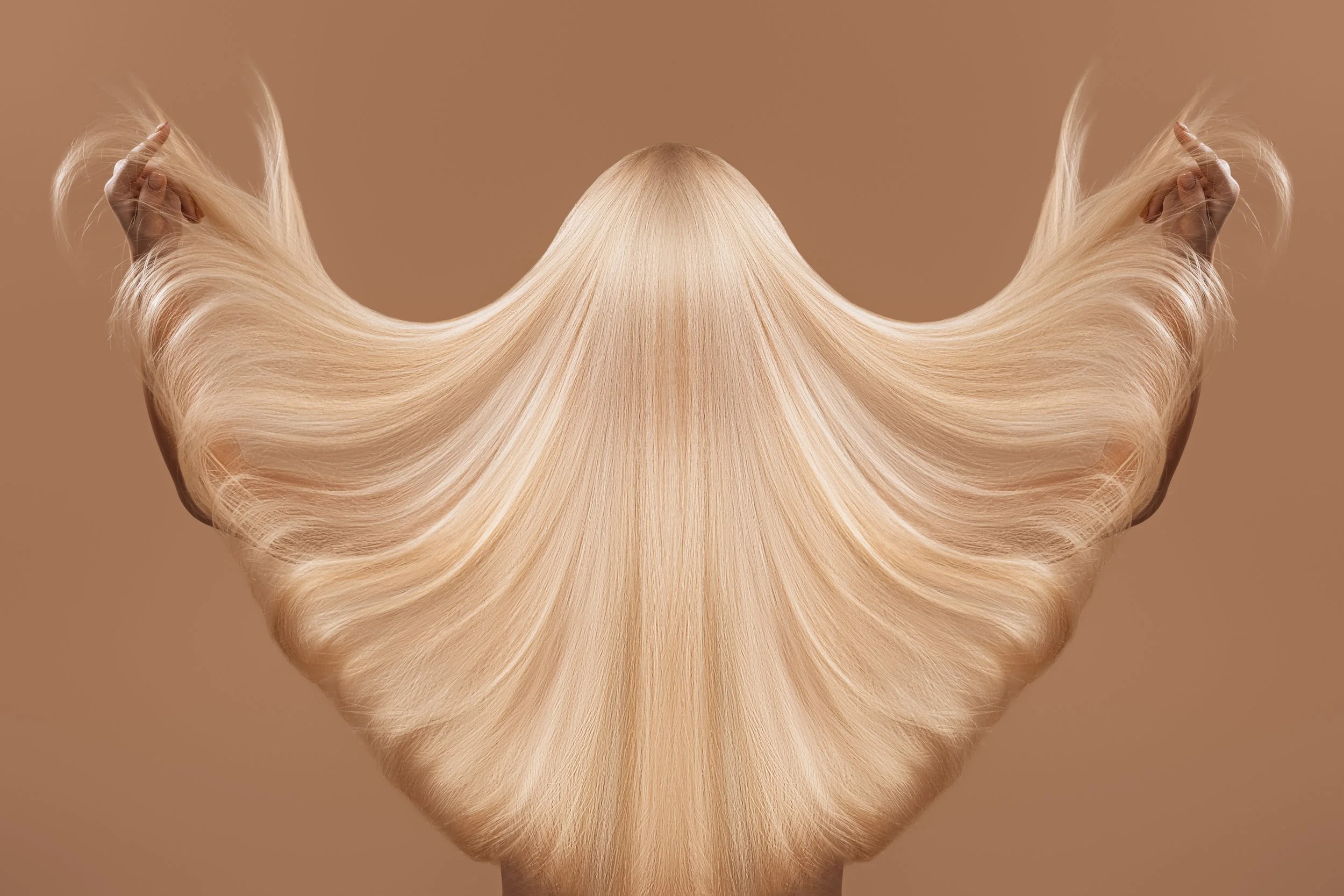 long blonde hair being fanned out with movement