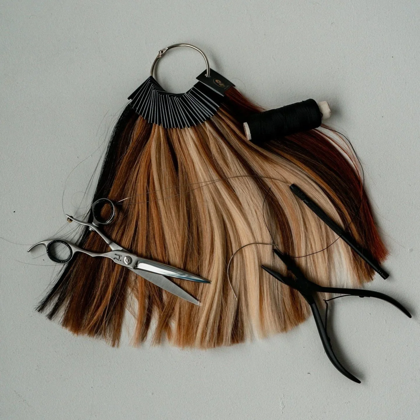 wefts of hair and the tools needed to install extensions