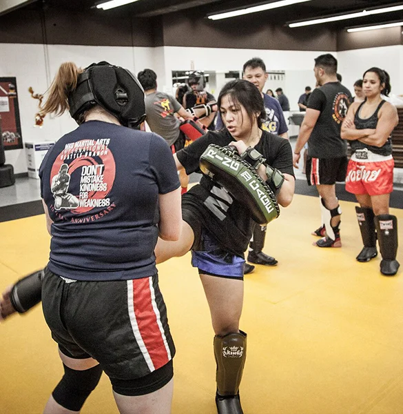 Muay_Thai_two_women_kicking2.jpg