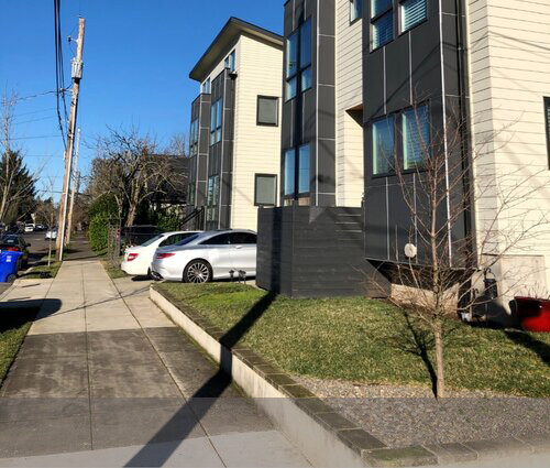 The front yards of these newer homes allow for only one tiny tree that, if alive in 50 years, will still be too short to shade buildings or streets.