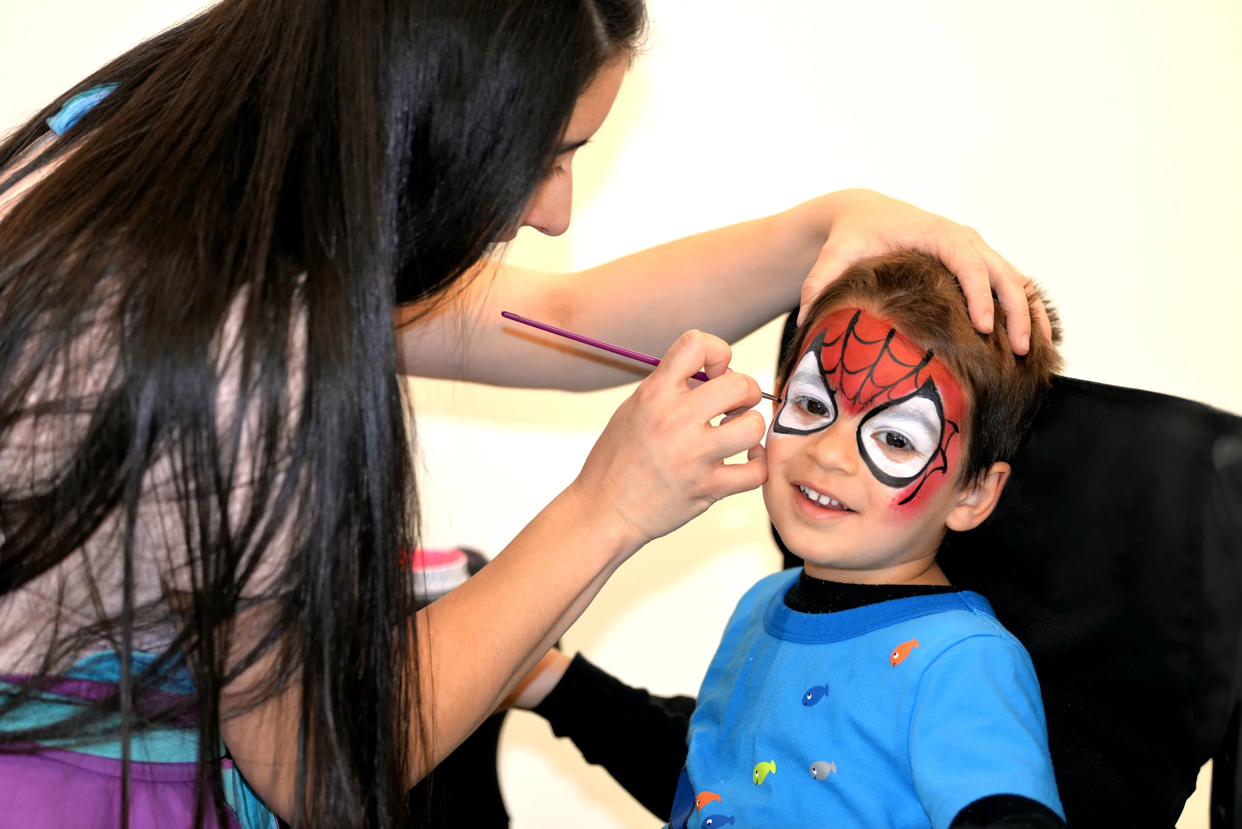 Spider man face painting design-Fort Worth school