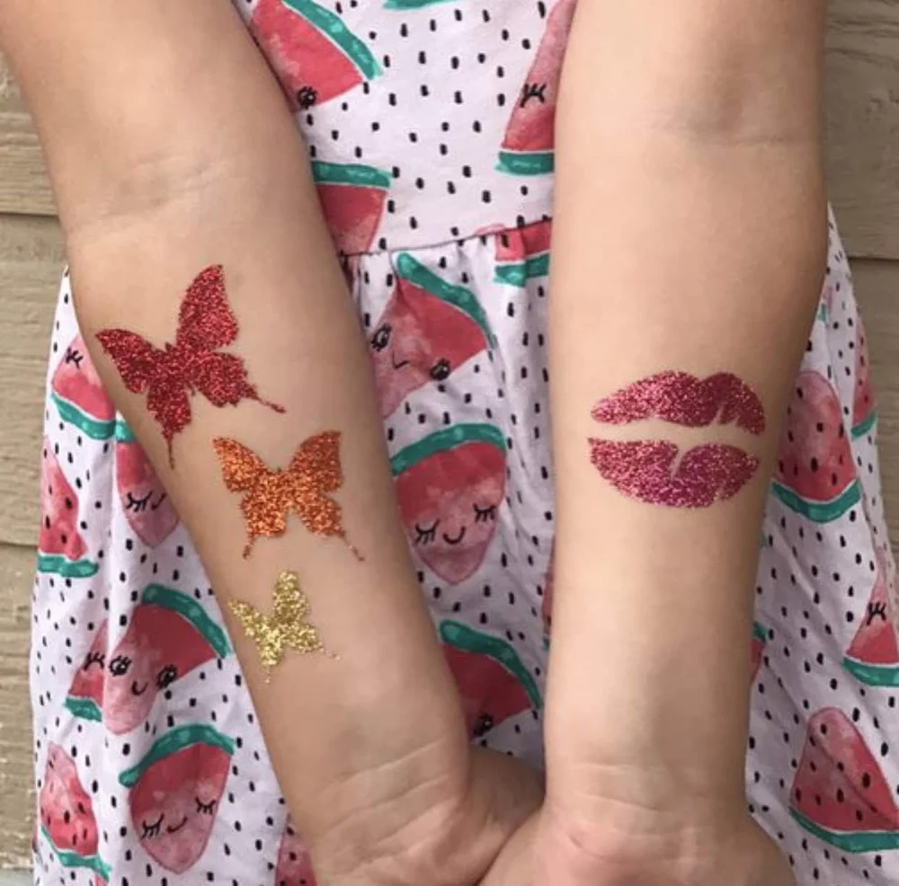 Butterfly and lips glitter tattoos