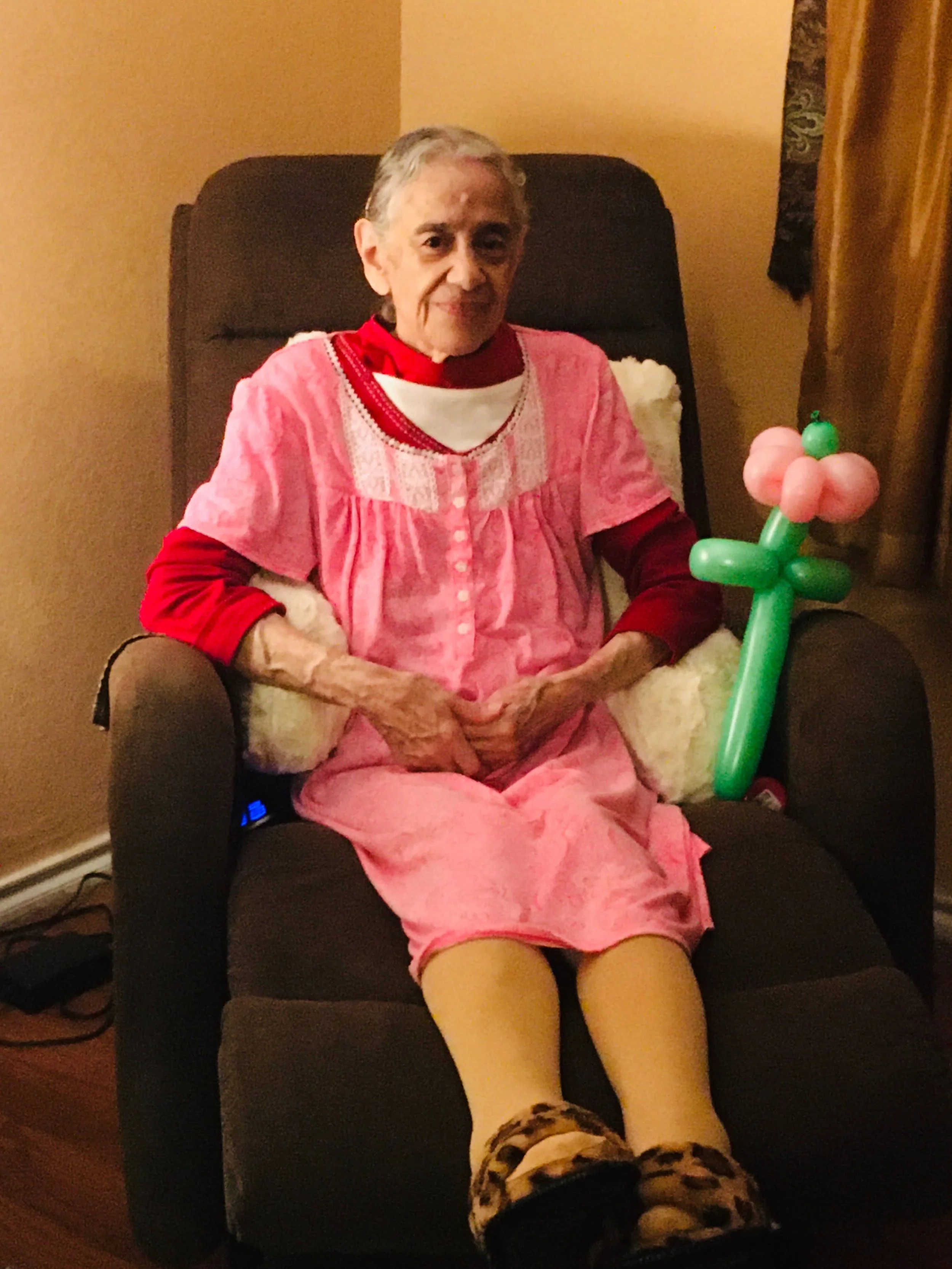 Woman holding a colorful balloon flower