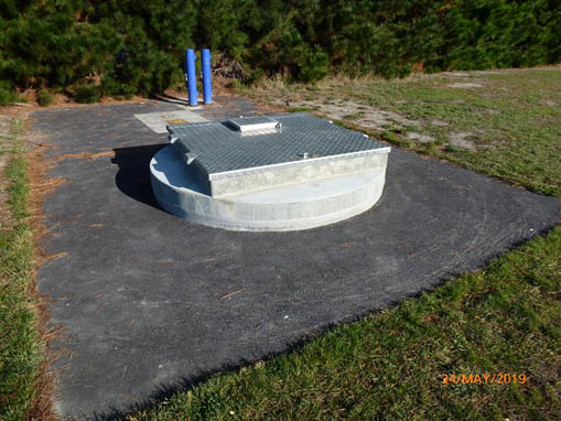 Extended well chamber with aluminium cover and grouted well casing