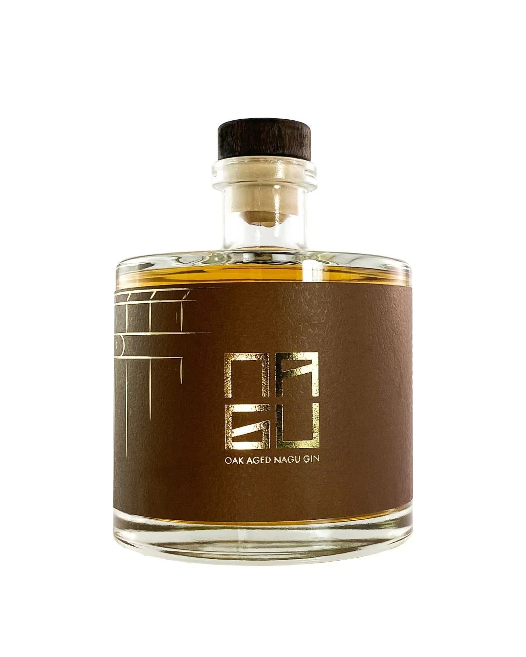 A glass bottle of oak aged Nagu gin with a brown label and a cork stopper.