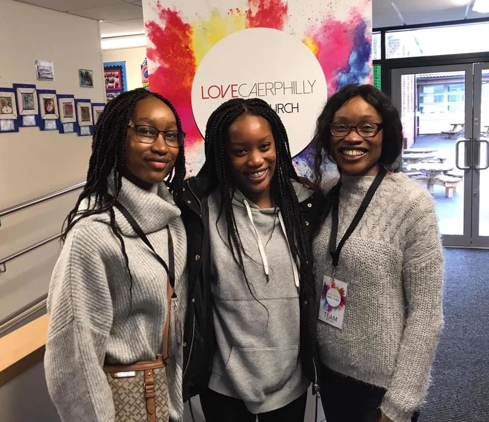 Three women on the Love Caerphilly team smile