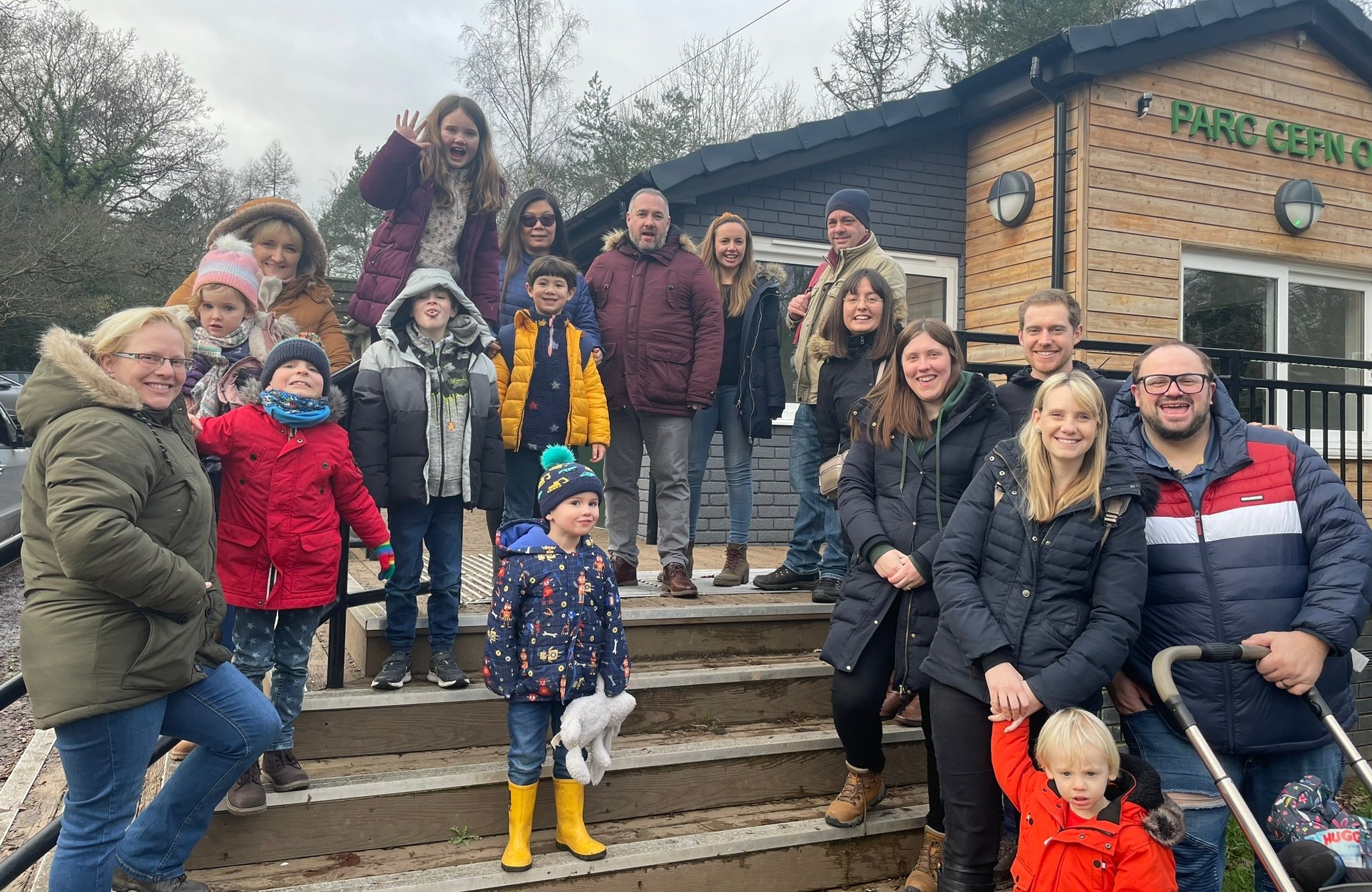 Kids and parents take a group photo on an outing in Caerphilly