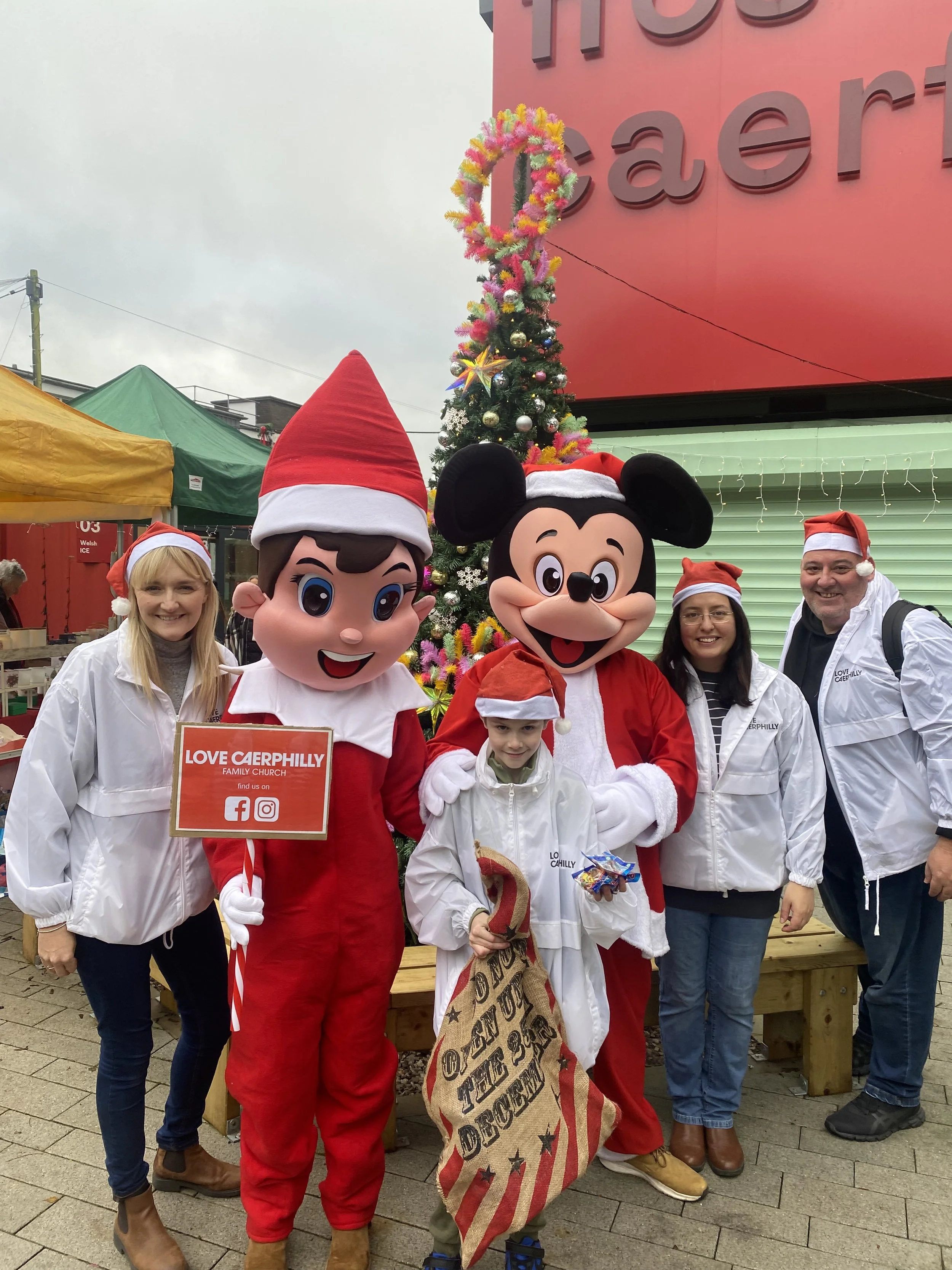 Kids pose with Christmas outfits in Caerphilly