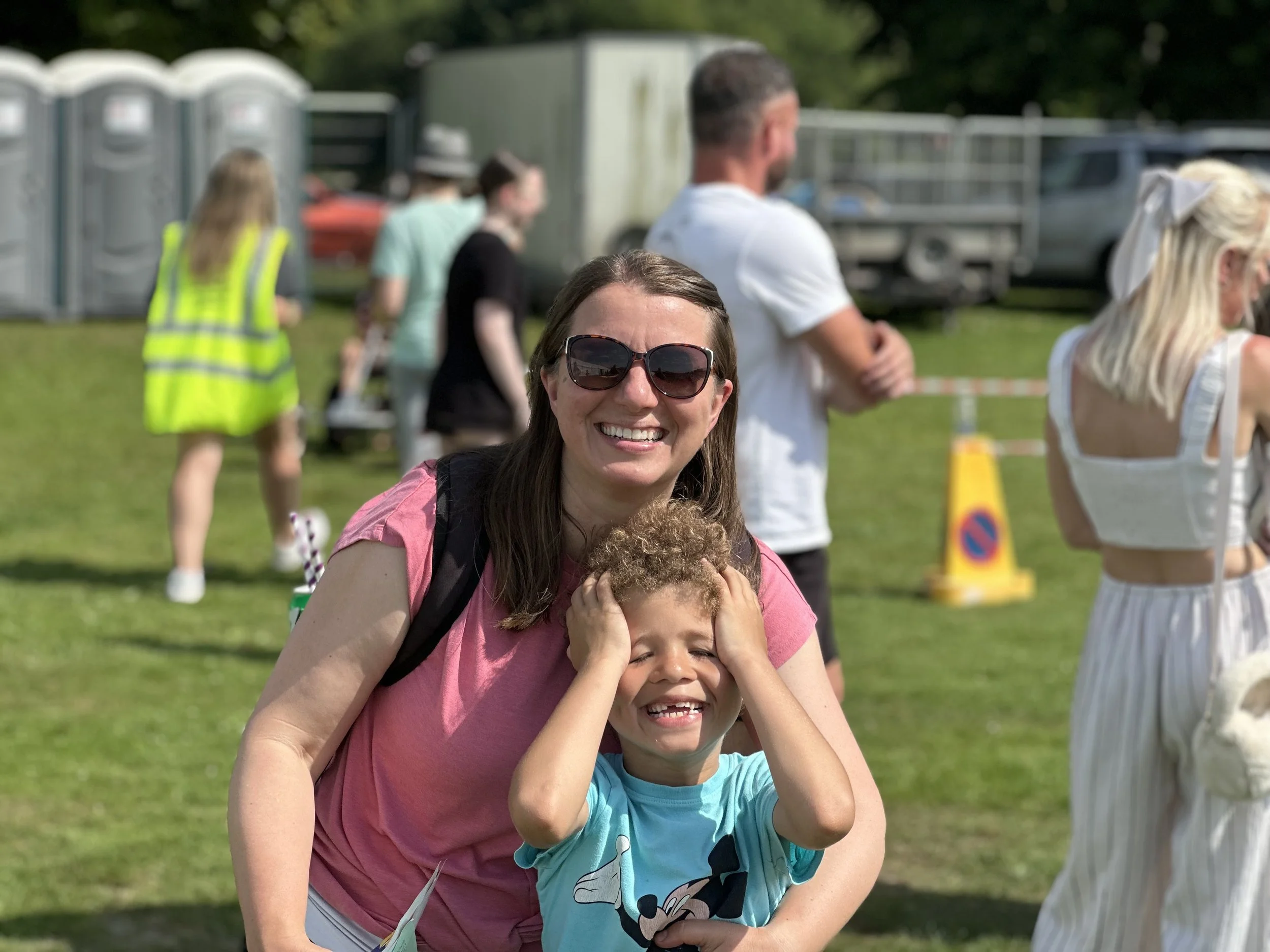Mum and child smile in the sunshine of Caerphilly