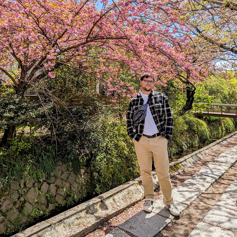  Posing at the Philosopher’s Path during  sakura  (cherry blossom) season, Kyoto, Japan (2023). 