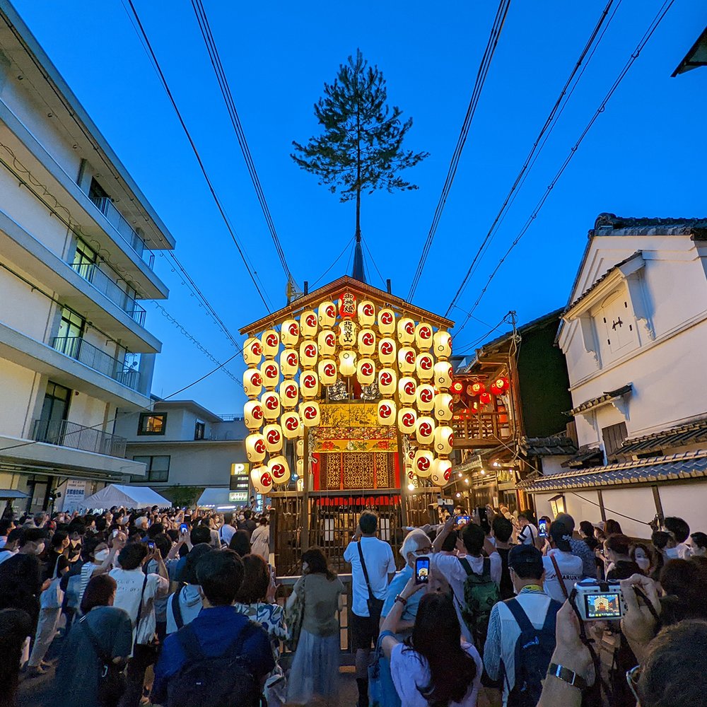  People gather around an illuminated  hoko  (float) near Shijo Kawaramachi during Gion Matsuri, Kyoto, Japan (2022). Photo by Danny With Love.  