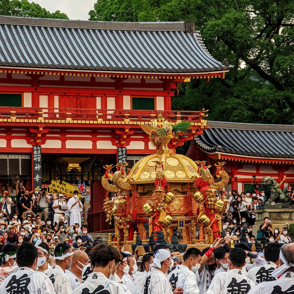   Mikoshi  (portable shrine) procession at the West Gate of Yasaka Shrine during Gion Matsuri, Kyoto, Japan (2022). Photo by Danny With Love. 