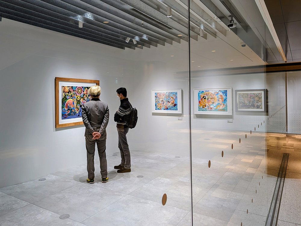  Visitors admire prints by One Piece creator Eiichiro Oda (尾田 栄一郎) at Shueisha Manga Art Heritage, Azabudai Hills, Minato City, Tokyo, Japan (2023). Photo by Danny With Love. 