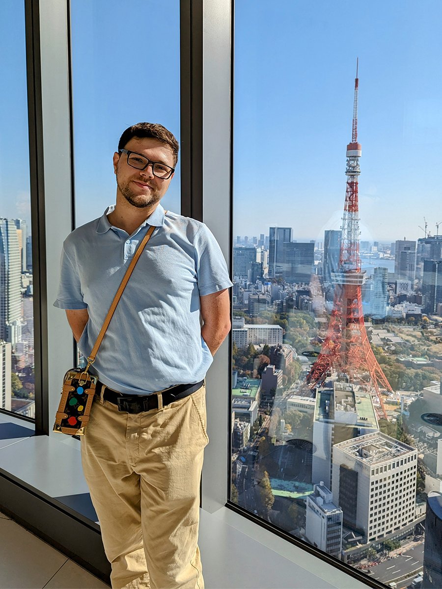  Posing with Tokyo Tower at the “Sky Lobby” of Azabudai Hills Mori JP Tower, Minato City, Tokyo, Japan (2023). 