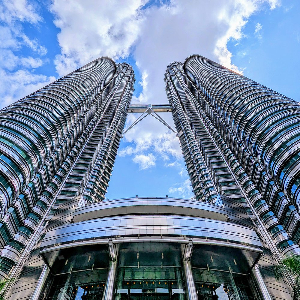  Looking up at the Petronas Twin Towers, Kuala Lumpur, Malaysia (2023). Photo by Danny With Love. 