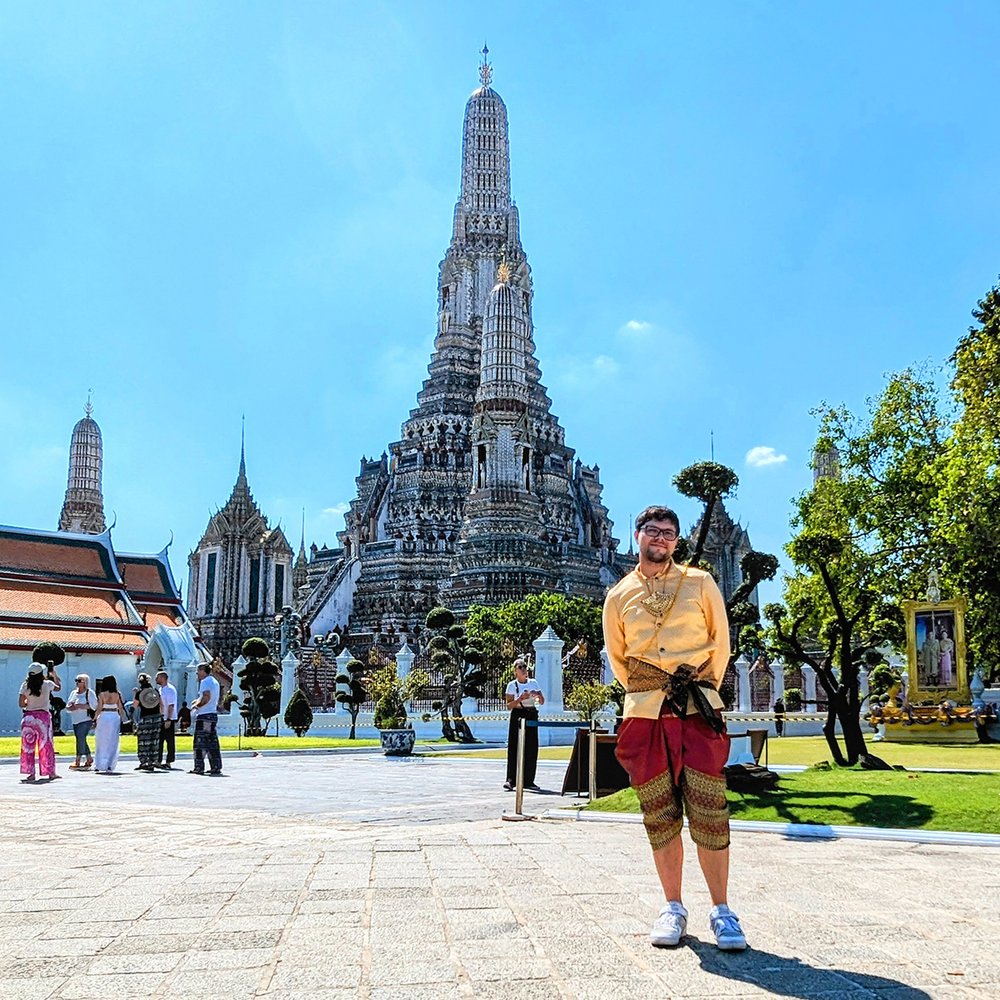  Posing in traditional clothing at Wat Arun (“Temple of Dawn”), Bangkok, Thailand (2024). 