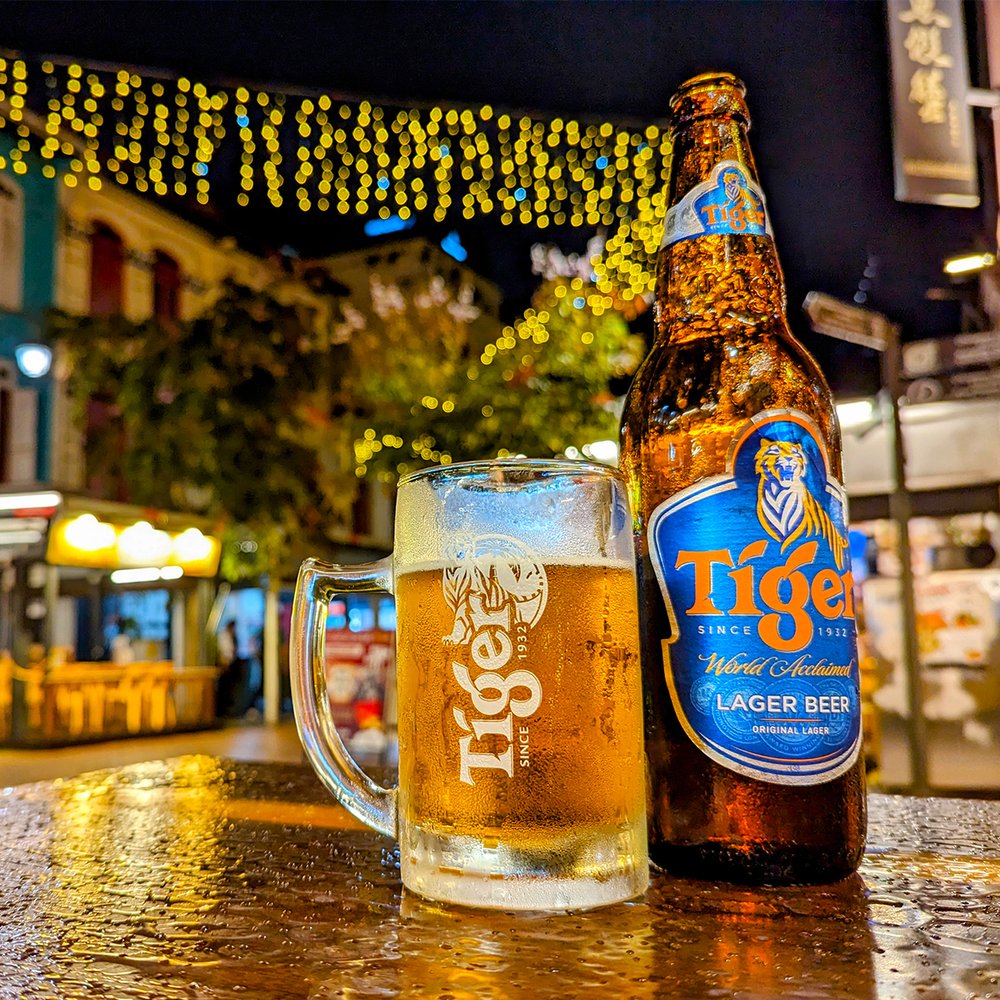  Enjoying a bottle of local Tiger Beer at Chinatown, Singapore (2023). Photo by Danny With Love. 