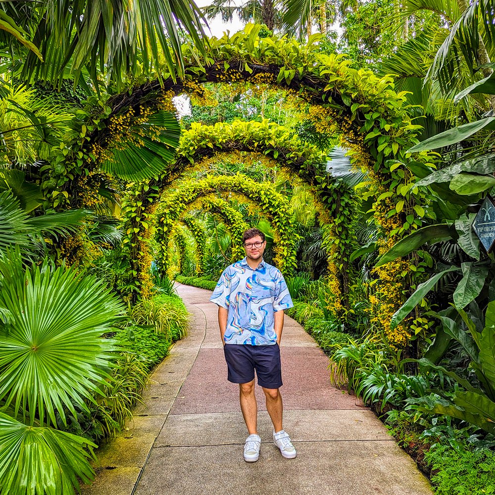  Posing with the Golden Shower Arches at the National Orchid Garden, of the UNESCO World Heritage Site Singapore Botanic Gardens, Singapore (2023). 