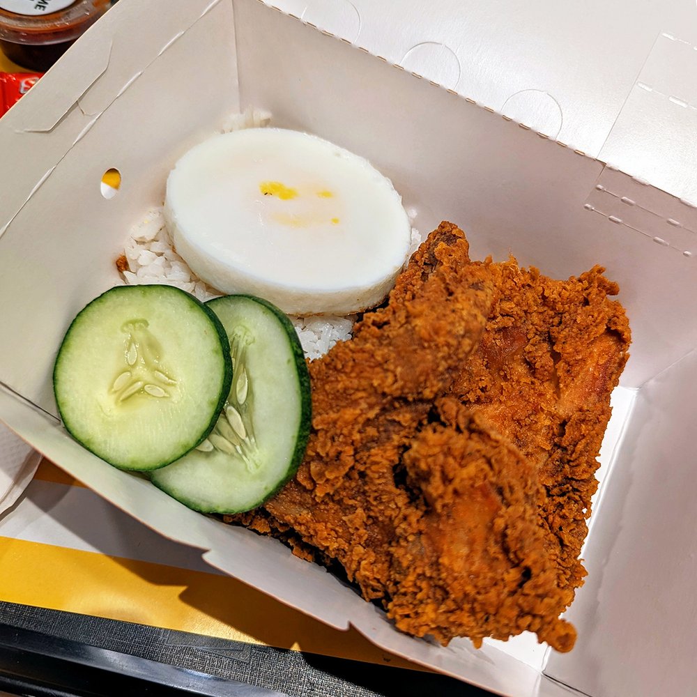   Nasi lemak  dish with fried chicken at McDonald’s, Kuala Lumpur, Malaysia (2024). Photo by Danny With Love. 