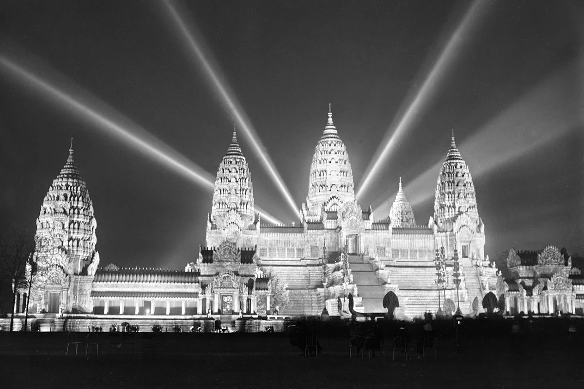 A massive replica of Angkor Wat is illuminated at night for the Paris Colonial Exposition in France, photo by the Rol Agency (1931). Via the National Library of France (color-corrected and cropped).