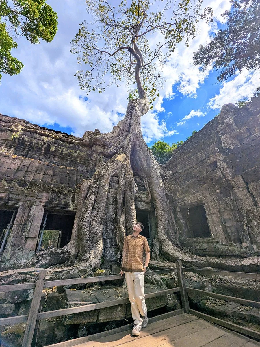 Posing at Ta Prohm Temple, Angkor, Cambodia (2025).