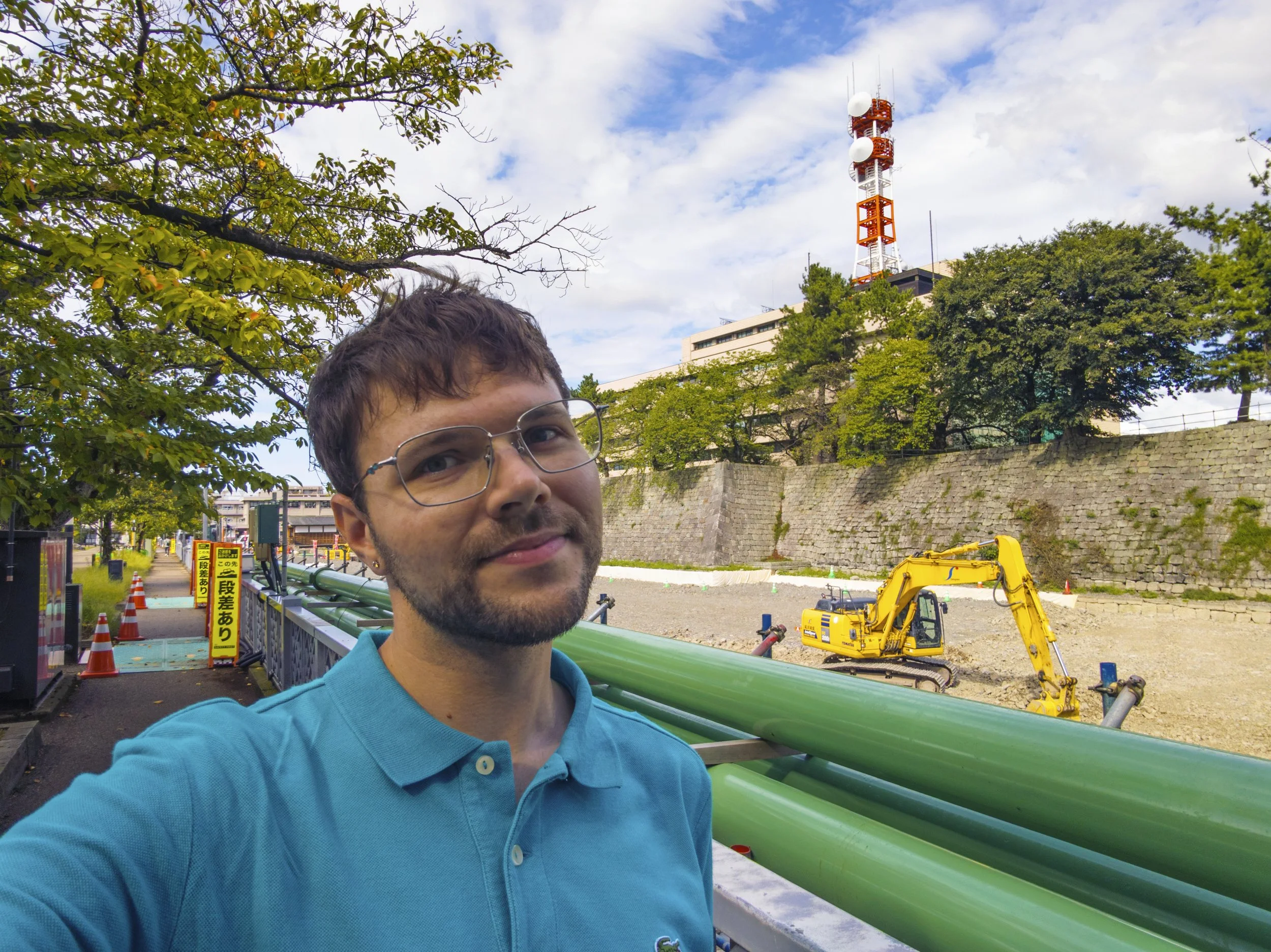 Posing outside the Kun-Yagura construction site, Fukui Castle Ruins, Fukui, Japan (2025). Photo by Danny With Love.