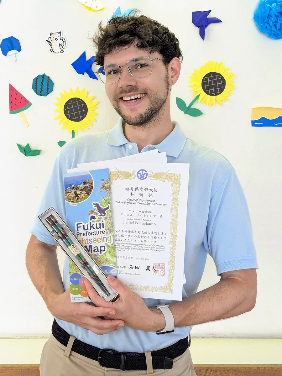 Posing with my Fukui Prefecture Friendship Ambassador certificate and Echizen lacquerware chopsticks, Fukui, Japan (2026).