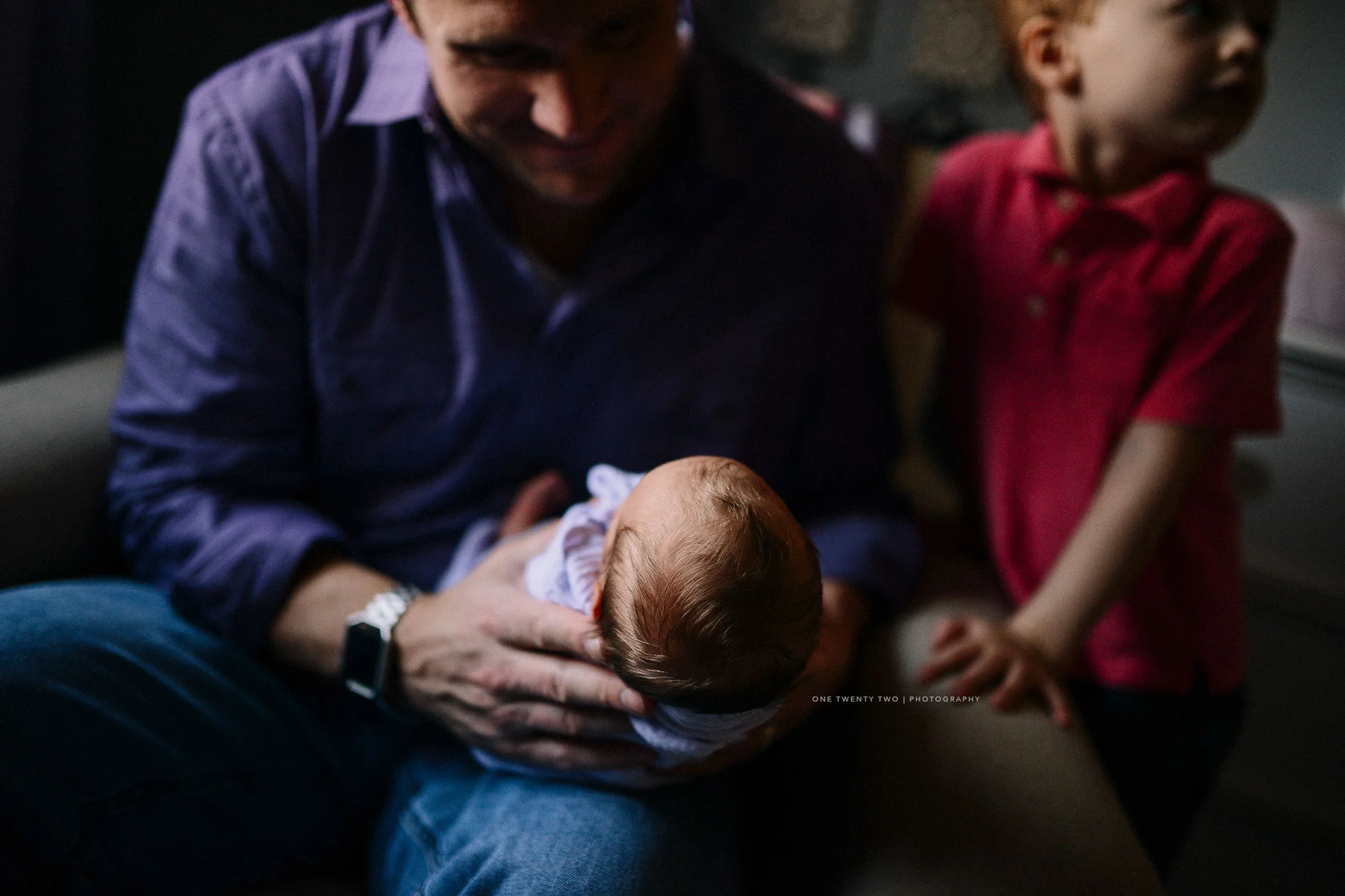 dad-son-and-newborn-pic-in-nursery-st-louis-one-twenty-two-photography.jpg