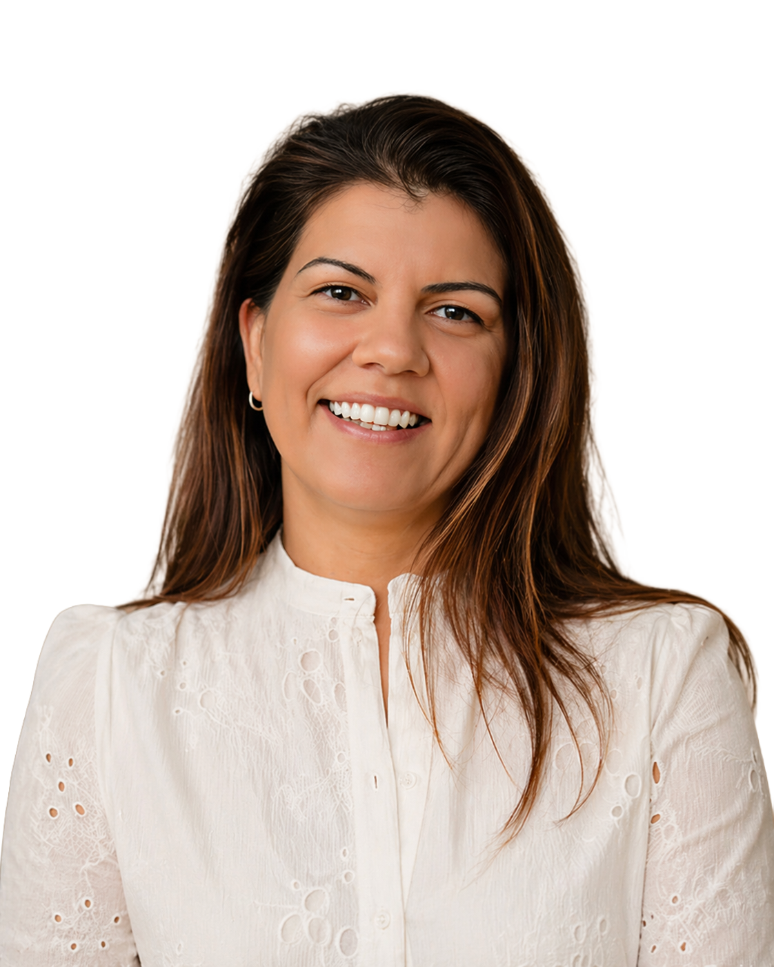 A woman with long brown hair smiling at the camera, wearing a white blouse with embroidered details.